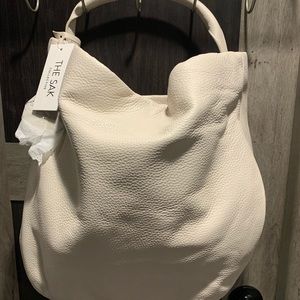 The SAK brand white leather bag.
